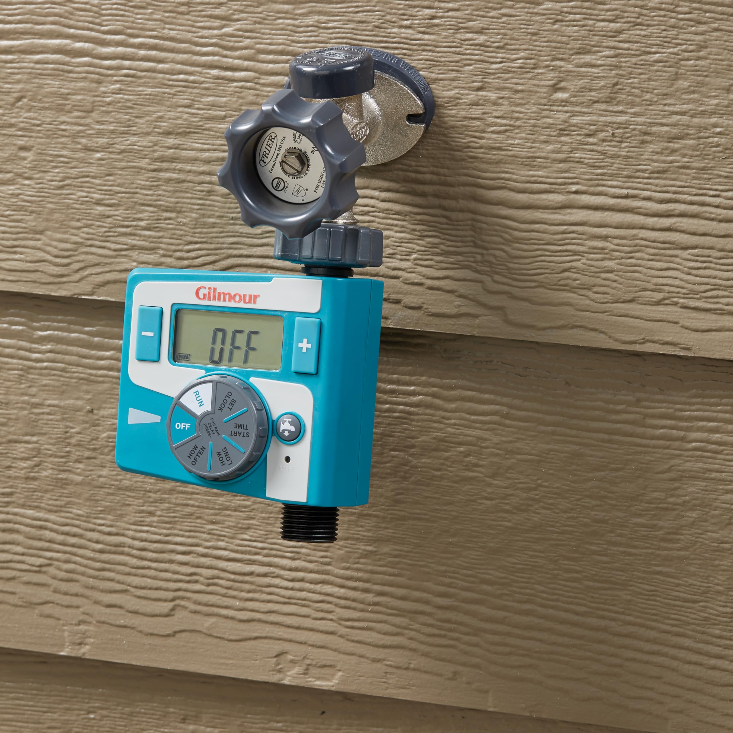 Gilmour timer in outdoor garden setup controls irrigation with ease.