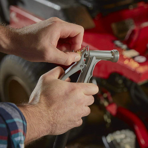 Gilmour nozzle features a hold-open clip for continuous spraying during watering tasks.