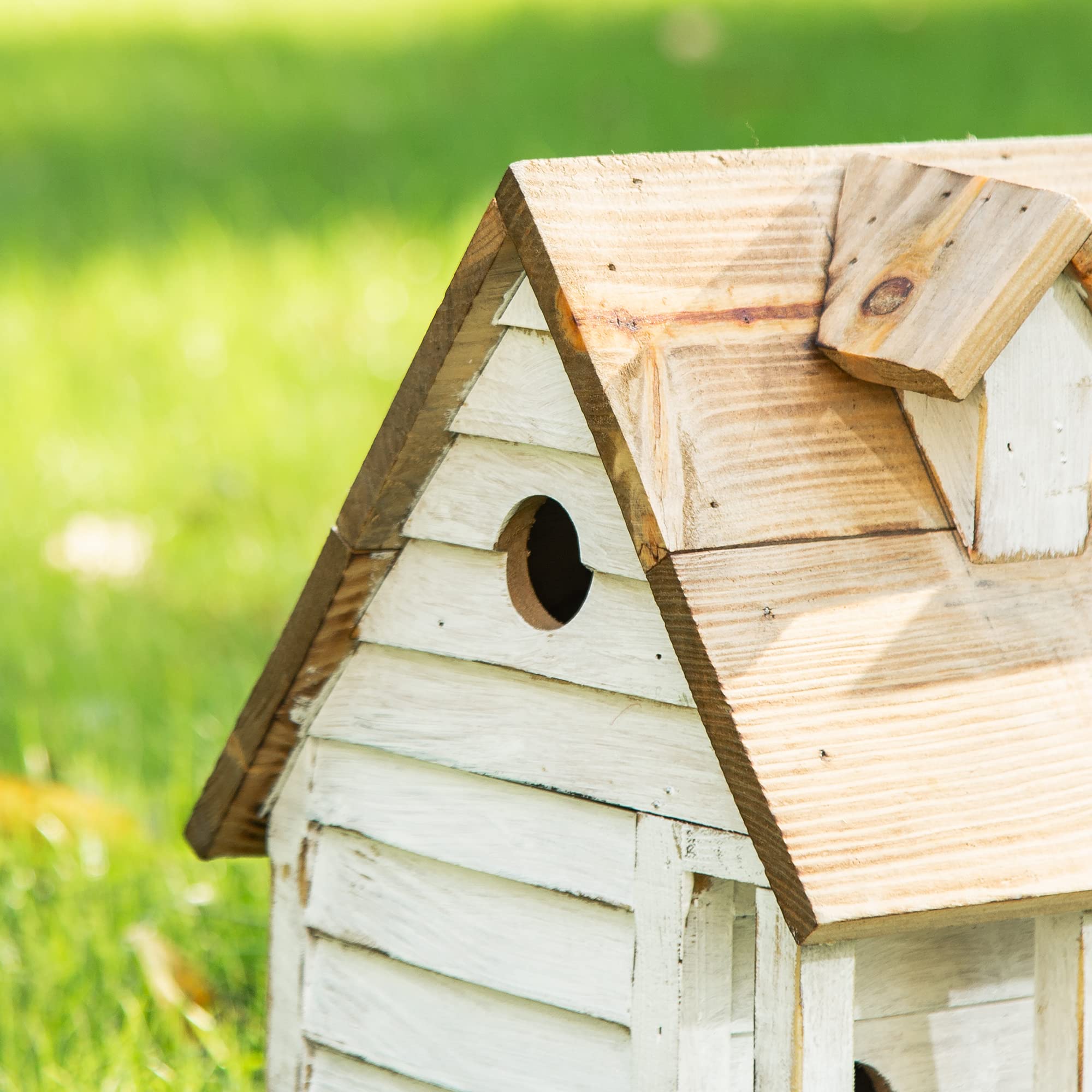 Glitzhome birdhouse displayed in outdoor garden for aesthetic appeal and nesting.