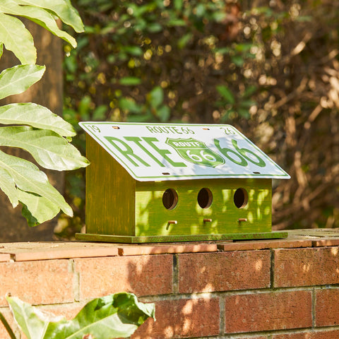 Glitzhome green distressed wood blends naturally with garden decor.
