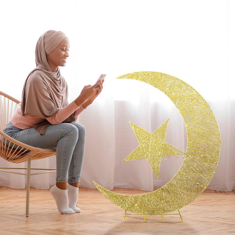 Glooglitter festival yard sign glows softly for Ramadan gatherings.