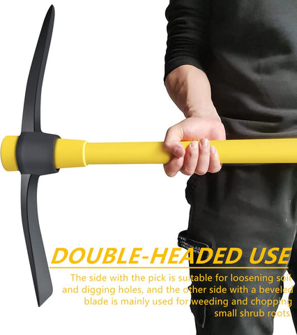 glorousamc mattock in grass with bright yellow handle for easy visibility.