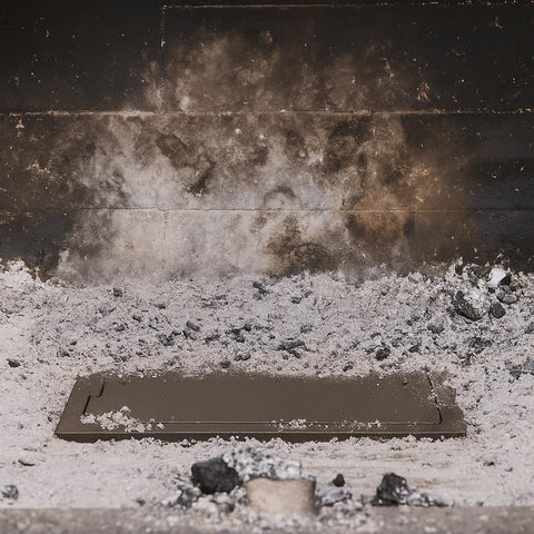 Glosaie in-use fireplace with ash dump door for easier maintenance