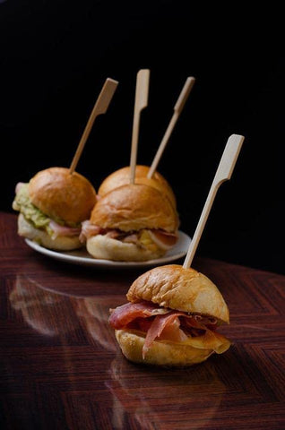 Gmark bamboo paddle skewers elevating appetizers and canapes on a platter.