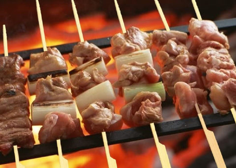 Gmark bamboo paddle skewers used as cocktail picks for chic garnishes.
