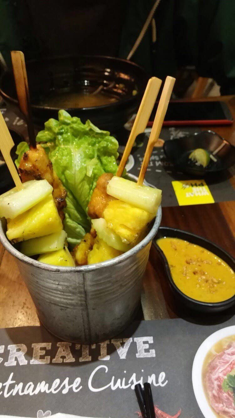 Gmark bamboo paddle skewers on grill during barbecue night.