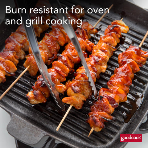 Loading vegetables and meat onto GoodCook skewers for quick prep.