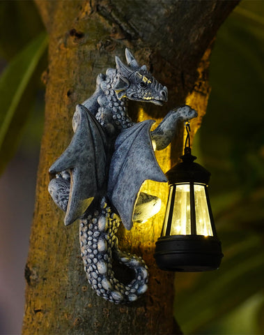 Goodeco Dragon Tree Hugger solar lantern lights the garden at night.