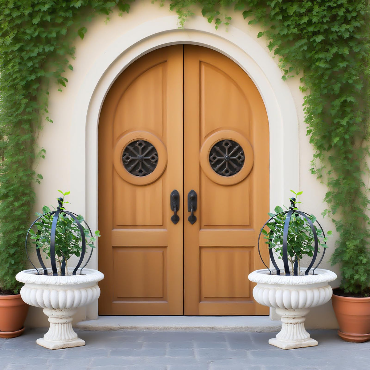 Goooxim 2-piece metal garden trellis obelisk supports climbing roses and vines outdoors.