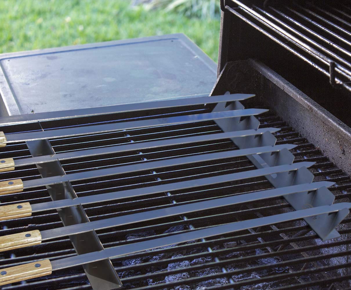 Goutime universal barbecue skewer holder mounted on grill.