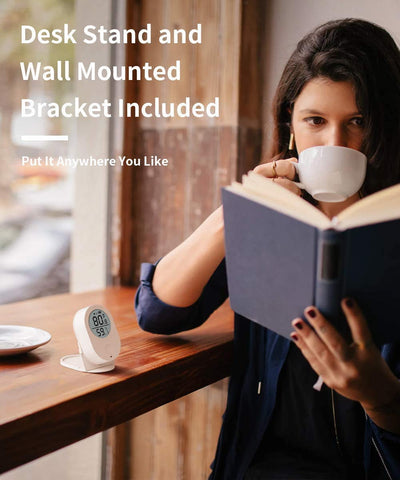 Govee H5051 compact sensor beside a workspace for discreet monitoring.