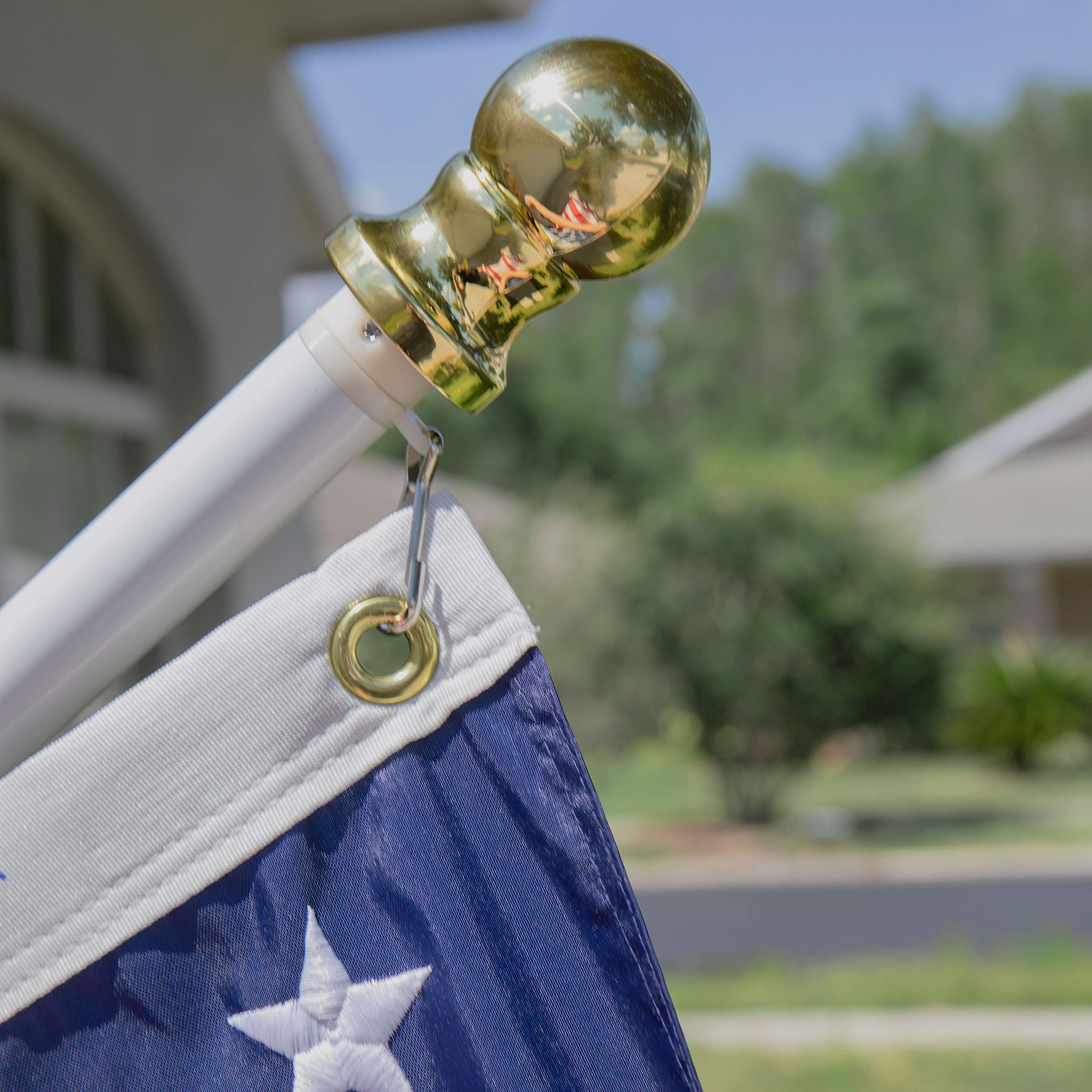 Grace Alley tangle-free design prevents flag furling during gusts on residential facades.