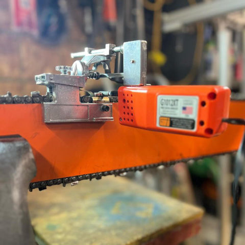 Granberg G1012XT in action on a chainsaw bar for maintenance.