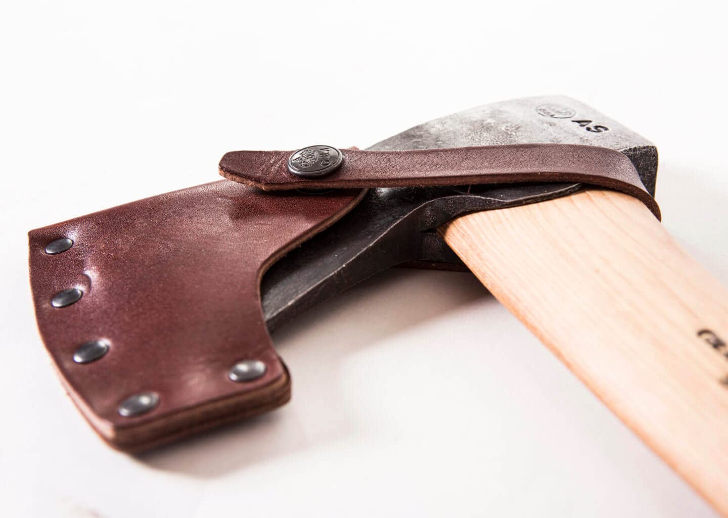 Gränsfors Bruks Small Forest Axe with leather sheath for safe transport.