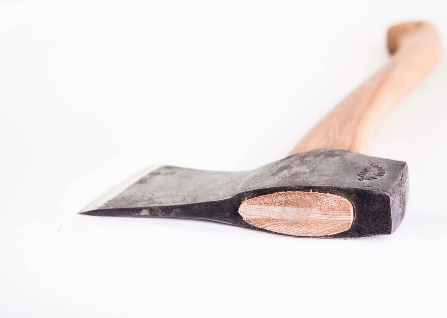 Gränsfors Bruks Small Forest Axe felling and limbing in compact woodlands.