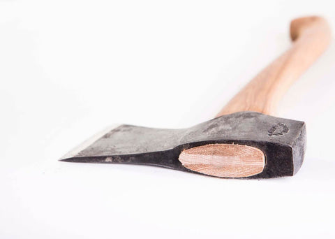 Gränsfors Bruks Small Forest Axe felling and limbing in compact woodlands.