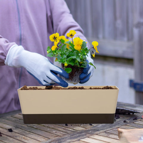 GREANER planter filled with herbs enhances kitchen ambiance