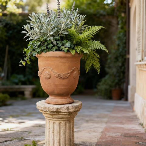 Greens Word planter-urn on the front porch elevates curbside charm.