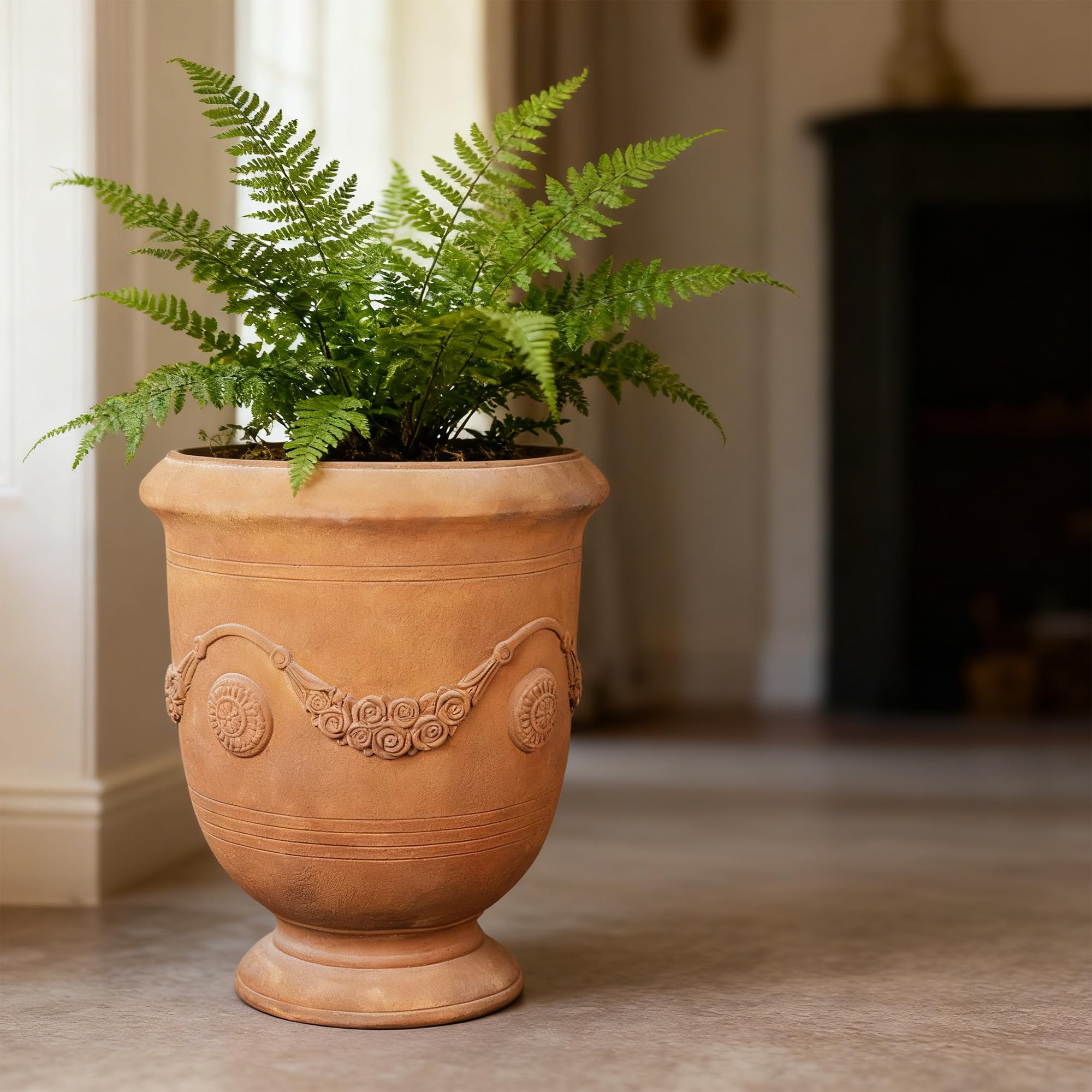 Greens Word planter-urn elegant-pattern-detail adds vintage flair to spaces.