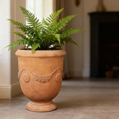 Greens Word planter-urn elegant-pattern-detail adds vintage flair to spaces.