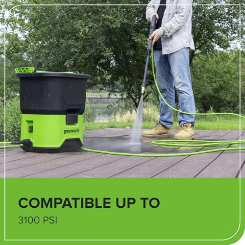 Greenworks 25ft Green High-Pressure Hose neatly coiled for easy outdoor storage.