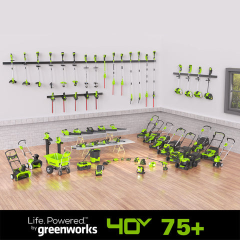 In-use Greenworks 40V battery powering cordless trimming sessions.