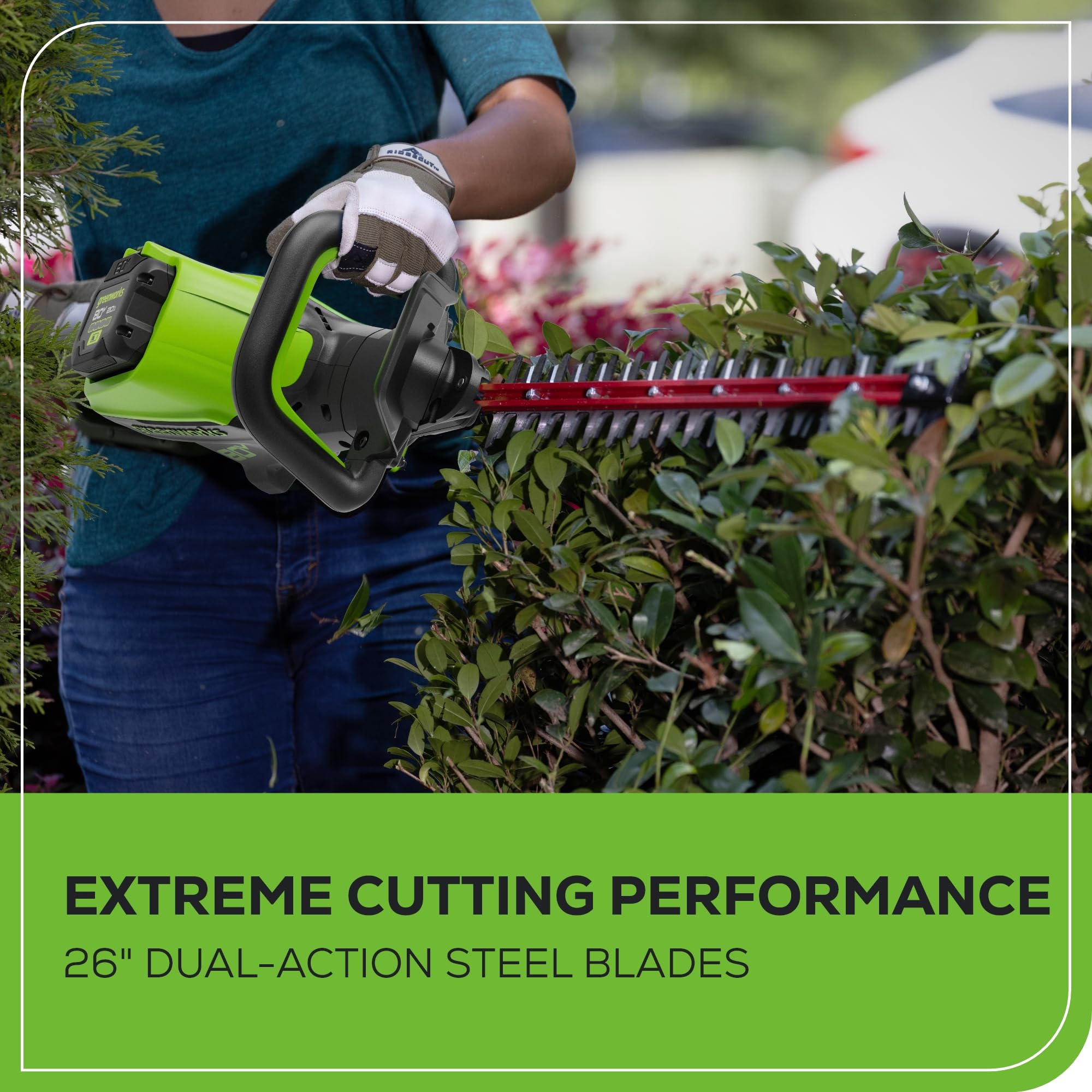 Greenworks extended-reach hedge trimmer helps trim tall shrubs safely.