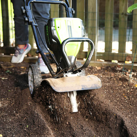 Greenworks Pro 80V tiller in action for garden bed prep.