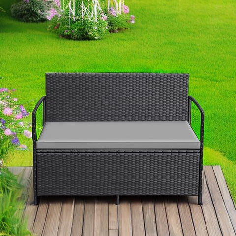 Greesum loveseat with red cushions adds vibrant outdoor comfort.
