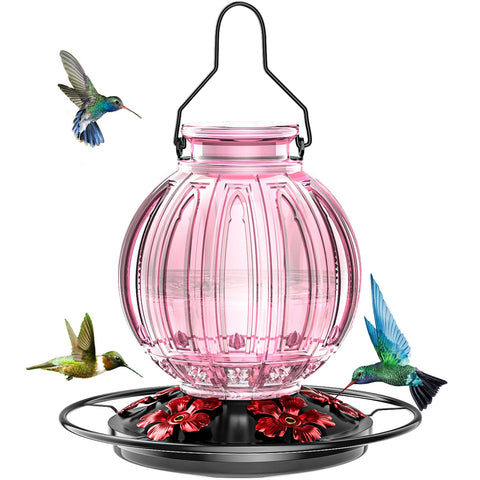 Grete Gotye pink glass hummingbird feeder outdoors attracts hummingbirds in outdoor spaces