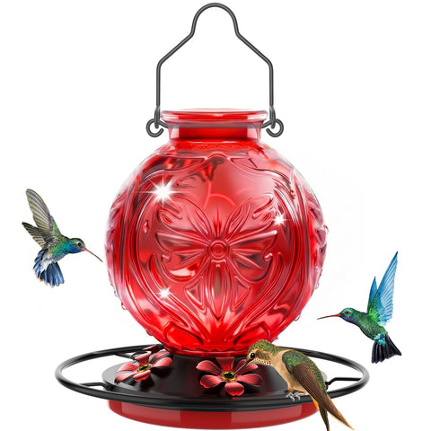 Grete Gotye glass hummingbird feeder with red flower ports attracts pollinators in the garden.