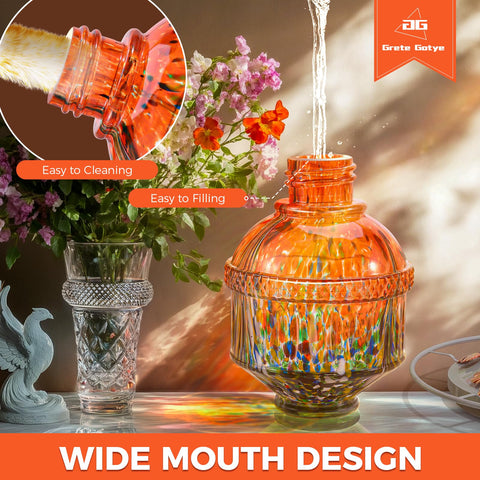 Grete Gotye orange outdoor hummingbird feeder enhances garden decor