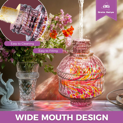 Grete Gotye wide-mouth glass feeder easy to fill and clean.