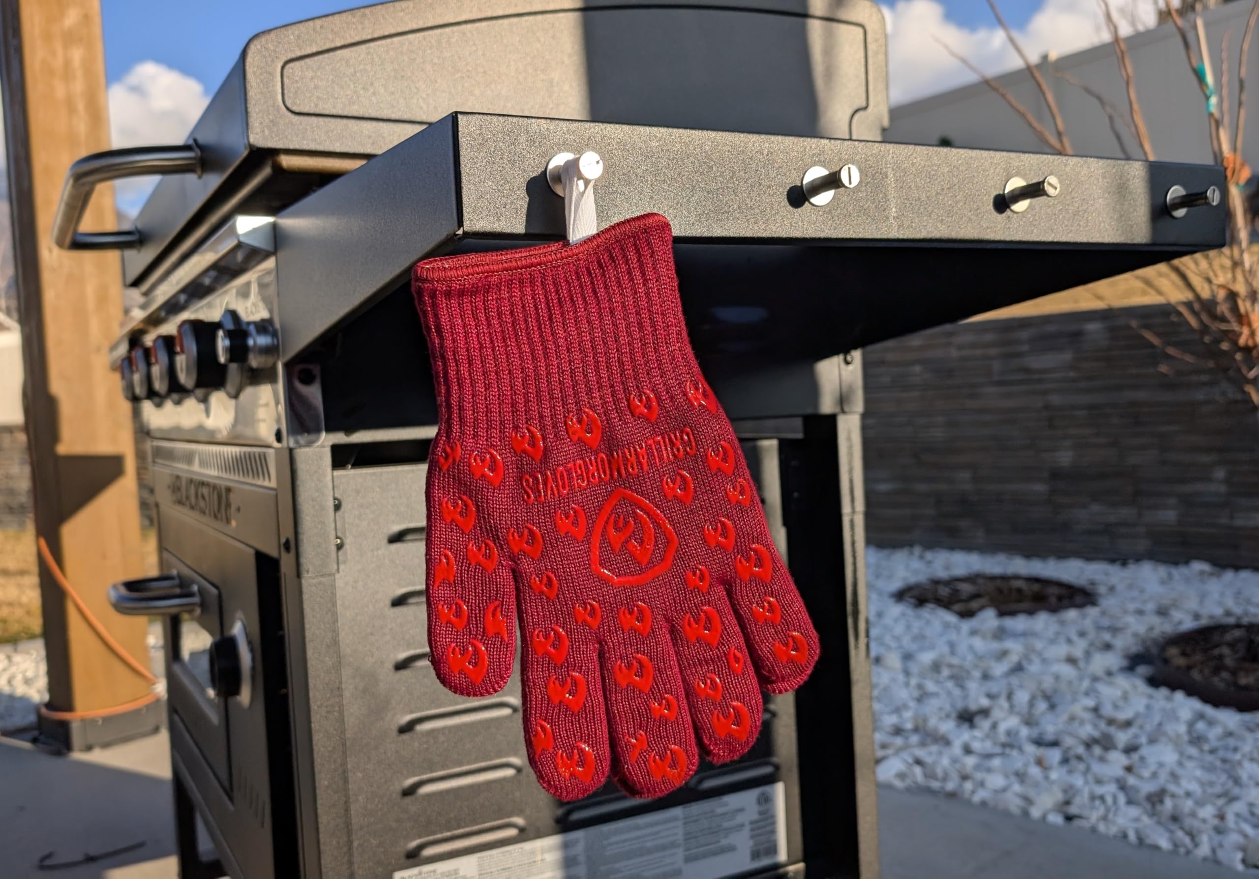 Grill Armor Gloves clear a hot pan from the oven safely.