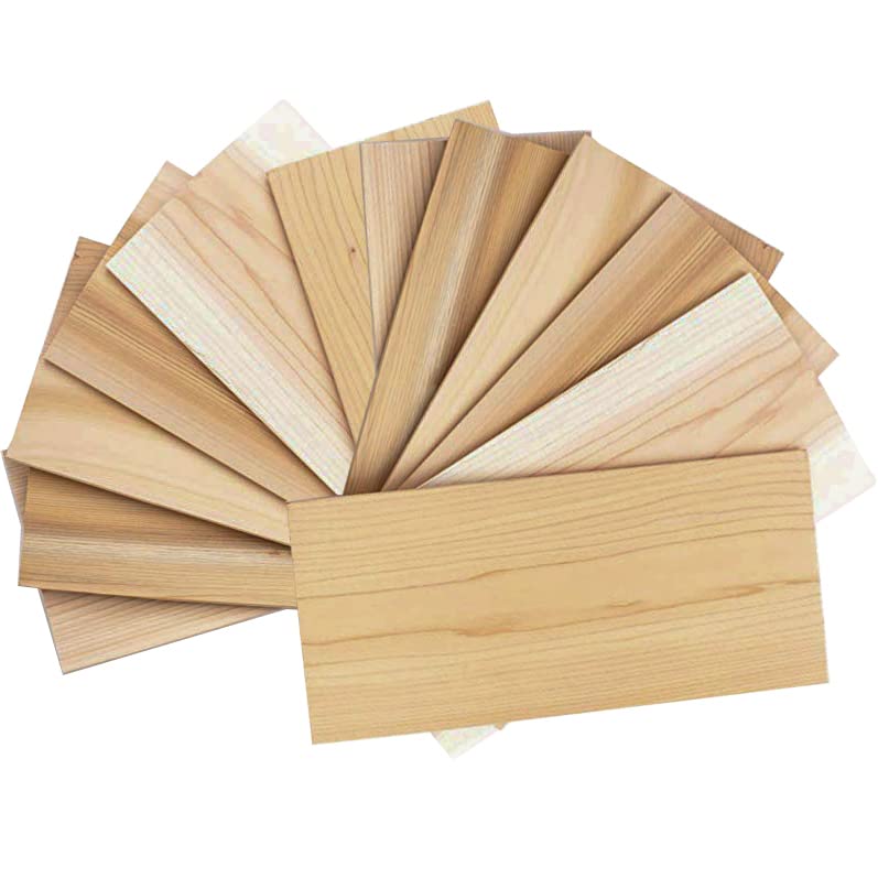 Grill Gourmet cedar plank 12-pack pack-shot on grill emphasizing USA-sourced quality