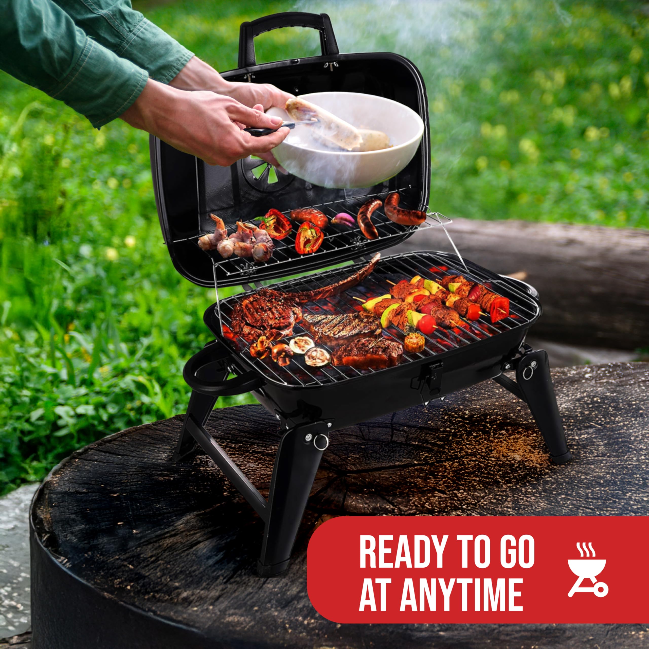 Grill Trade tabletop charcoal grill setup on a picnic table for quick meals.