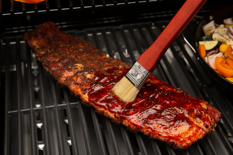 GrillPro basting brush hanging loop design keeps brush ready between uses.