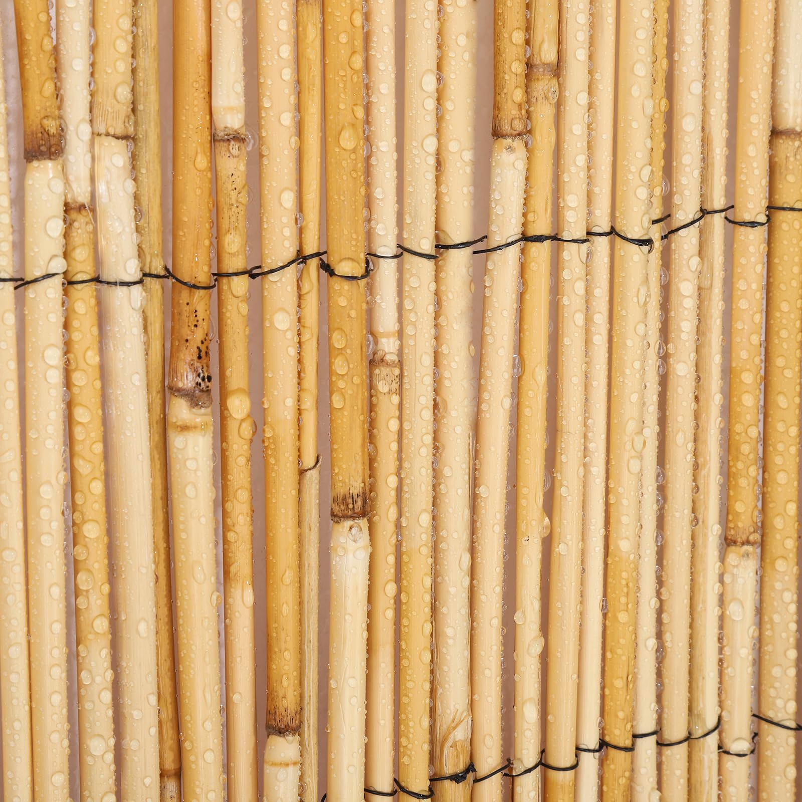 Groovboo reed fence decor brings natural ambience to a yard.