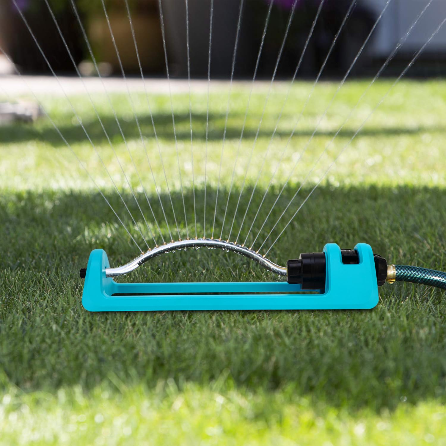 Blue GUDWING sprinkler adds a sleek look to irrigation setup.
