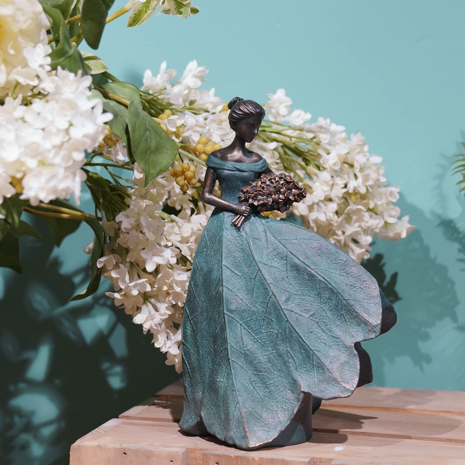 Guichifun fairy statue with lily accent adds grace as a centerpiece on shelves or patios.