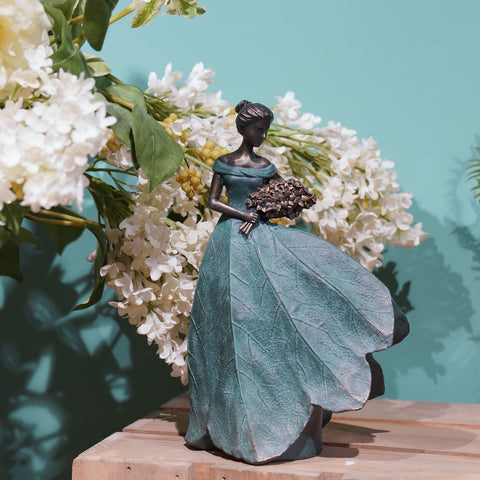 Guichifun fairy statue with lily accent adds grace as a centerpiece on shelves or patios.