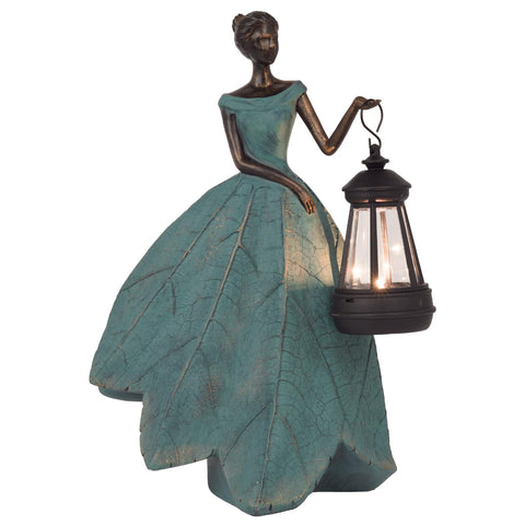 Guichifun fairy statue solar light glows softly in the garden at dusk