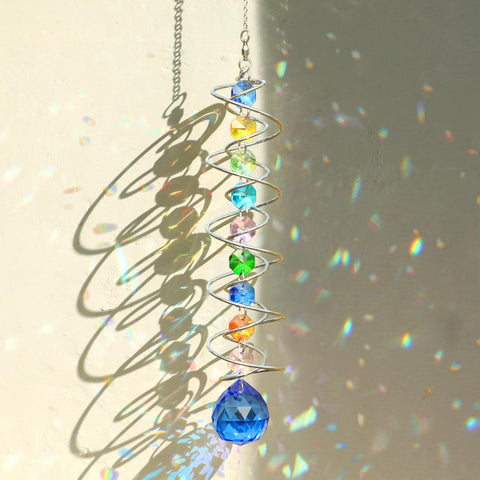 GWAHSA sun catcher gazing ball with spiral tail creates sunlit rainbows on windows.