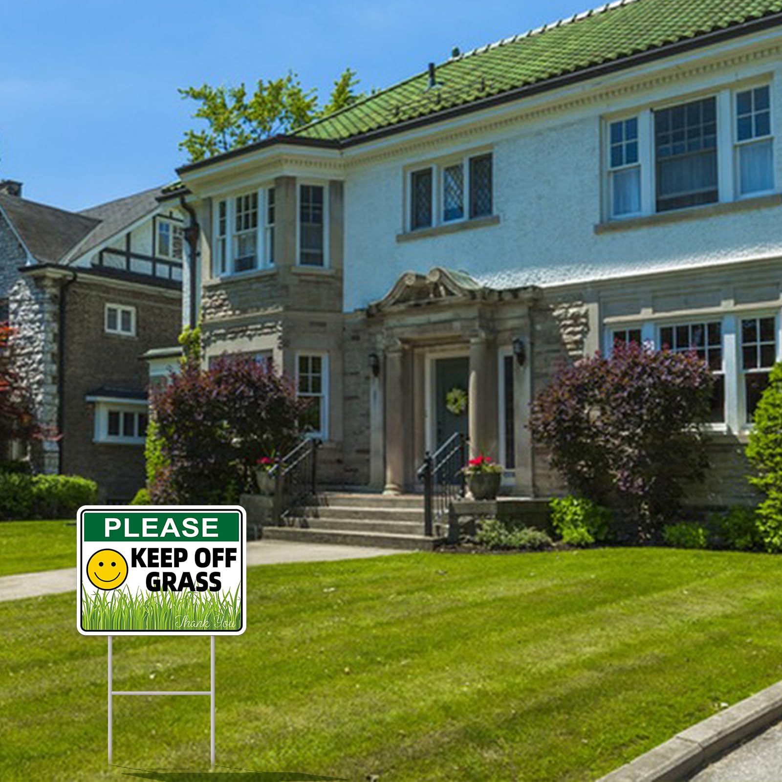 GXGGUS Keep Off Grass sign placed in a garden to deter foot traffic