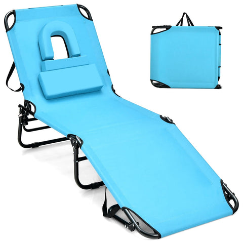 GYMAX tanning chair with face hole for comfortable sunbathing outdoors.