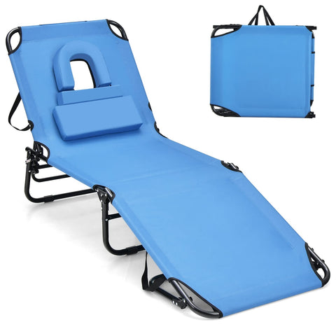 GYMAX tanning chair with face hole for comfortable outdoor sunbathing.