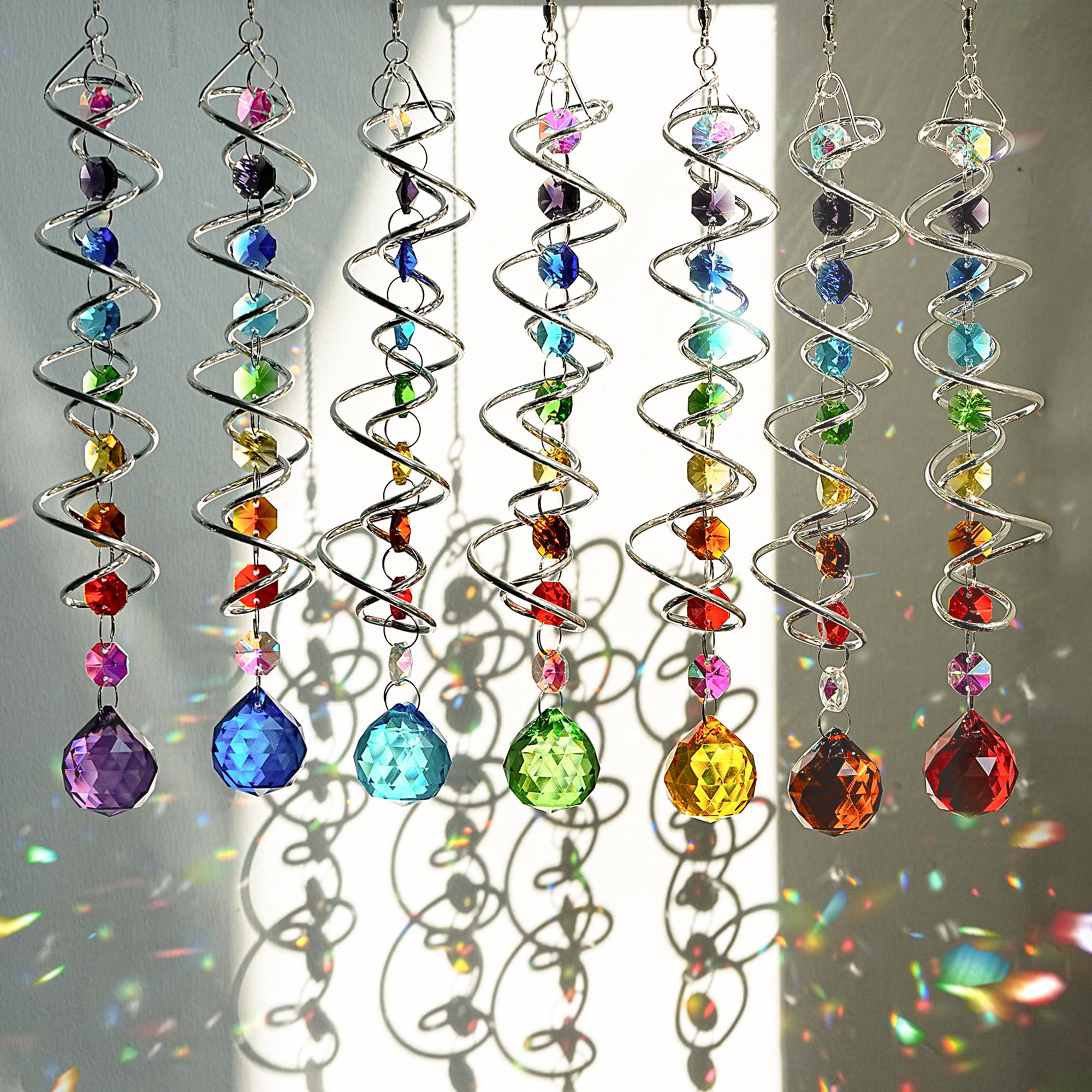 H and D Hyaline and Dora crystal suncatchers brighten windows with rainbow reflections.
