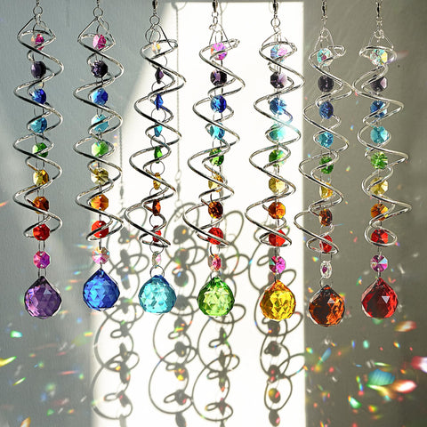 H and D Hyaline and Dora crystal suncatchers brighten windows with rainbow reflections.