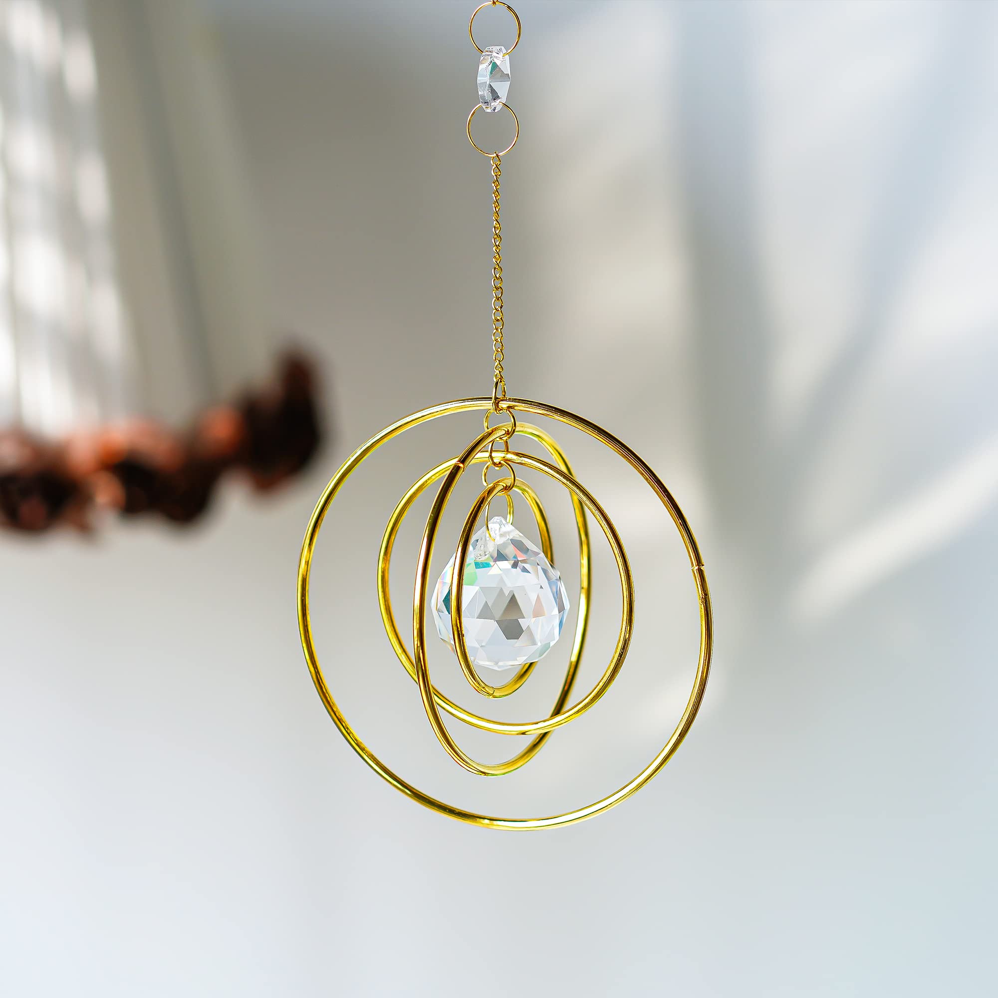 H&D Hyaline & Dora Brass Circles frame enhances window with celestial charm