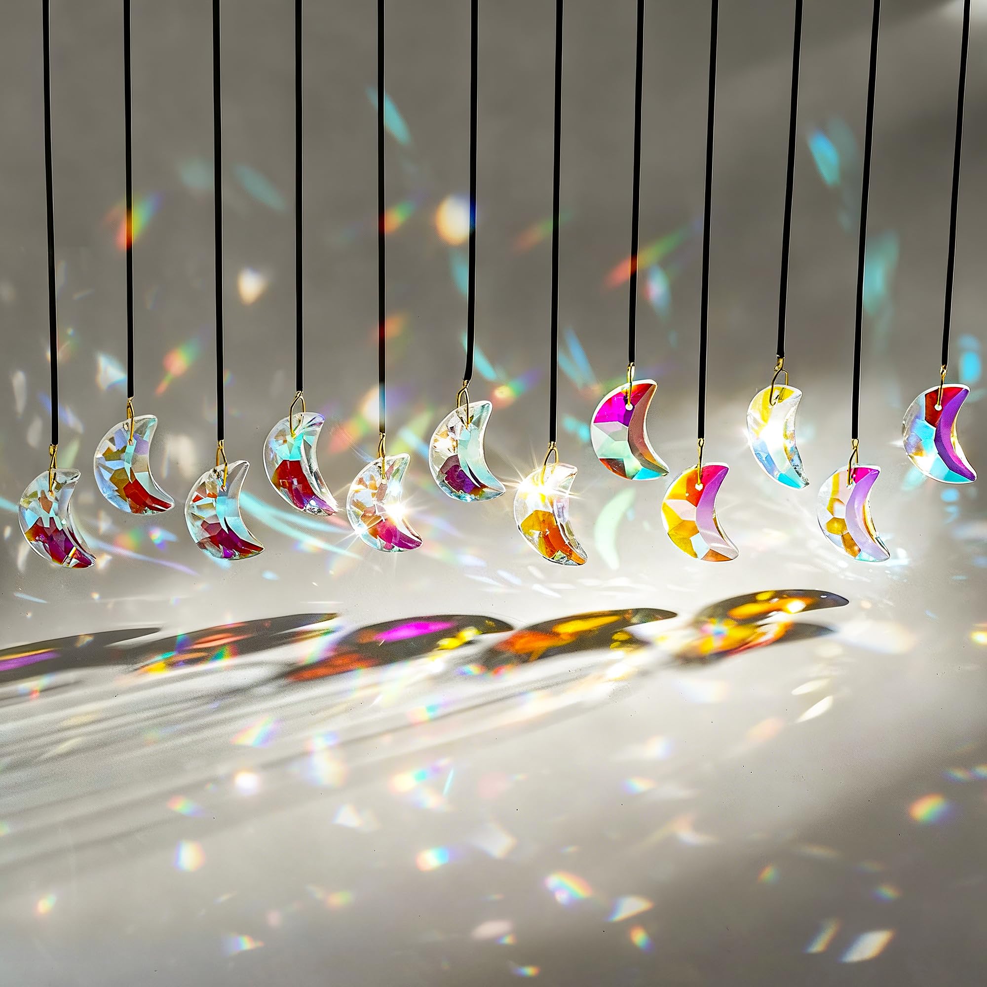 H&D HYALINE & DORA crystal suncatcher close-up catching sunlight with vivid prism glow.